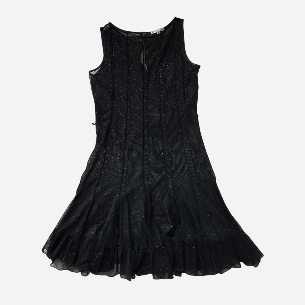 Black sheer mini dress with sequin details and ruffle hem.